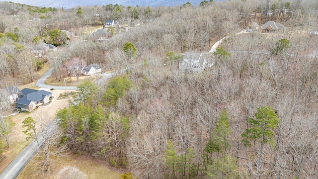 drone / aerial view featuring a forest view