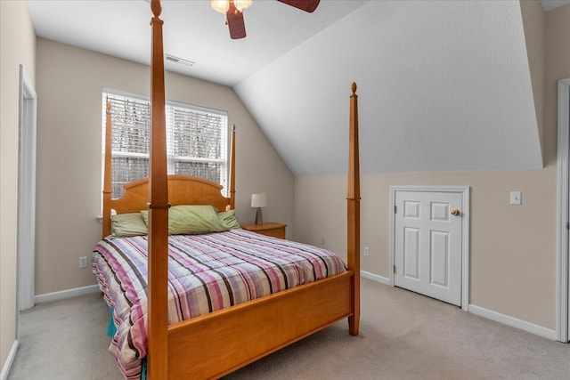 carpeted bedroom with lofted ceiling, a ceiling fan, and baseboards