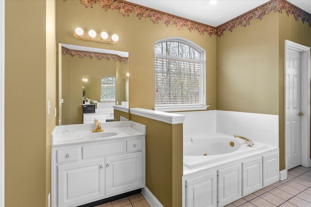 full bath with vanity, tile patterned floors, and a tub with jets