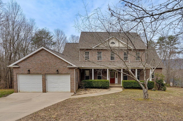 view of front facade featuring brick siding, a shingled roof, a front lawn, a garage, and driveway