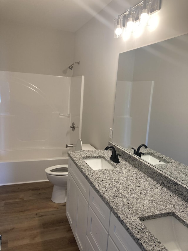 2486 Jason Dr, Chapel Hill, TN 37034 - full bath featuring a sink, washtub / shower combination, toilet, and wood finished floors
