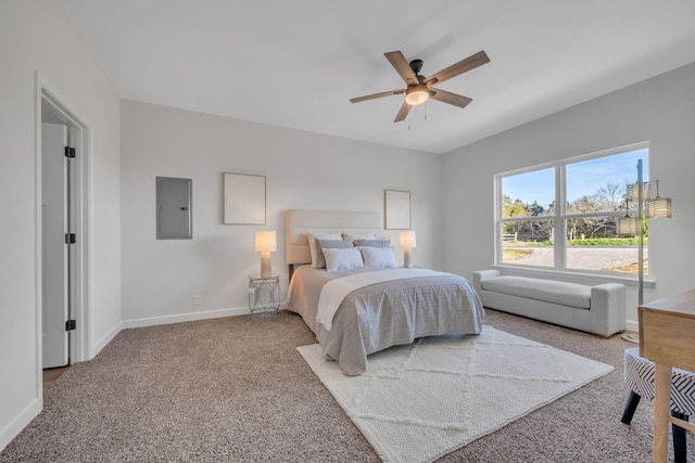 carpeted bedroom featuring electric panel, baseboards, and a ceiling fan