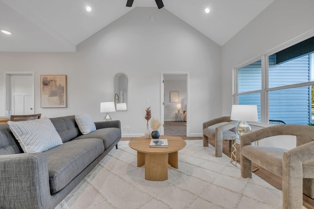 living room featuring high vaulted ceiling, a ceiling fan, recessed lighting, arched walkways, and baseboards