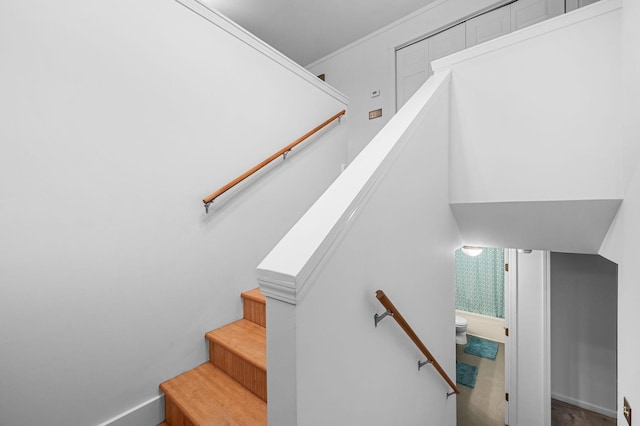 stairway featuring baseboards