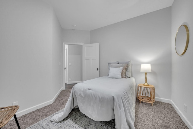 bedroom featuring baseboards and carpet flooring