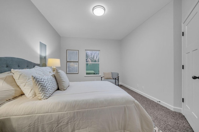 carpeted bedroom featuring baseboards