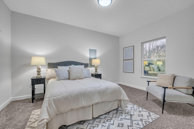 carpeted bedroom featuring baseboards