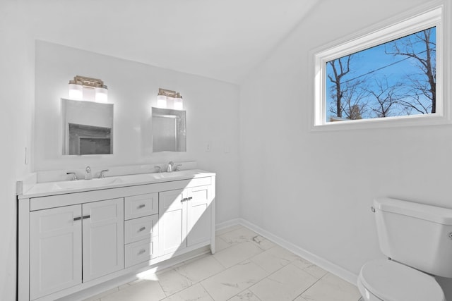 full bath featuring toilet, baseboards, marble finish floor, and a sink