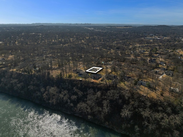 drone / aerial view with a water view and a wooded view