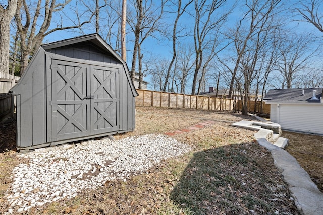 view of shed with a fenced backyard