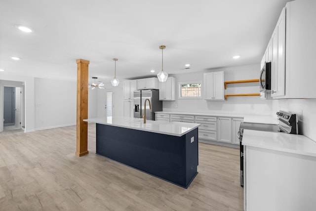 kitchen featuring a ceiling fan, open shelves, light wood-style flooring, light countertops, and appliances with stainless steel finishes