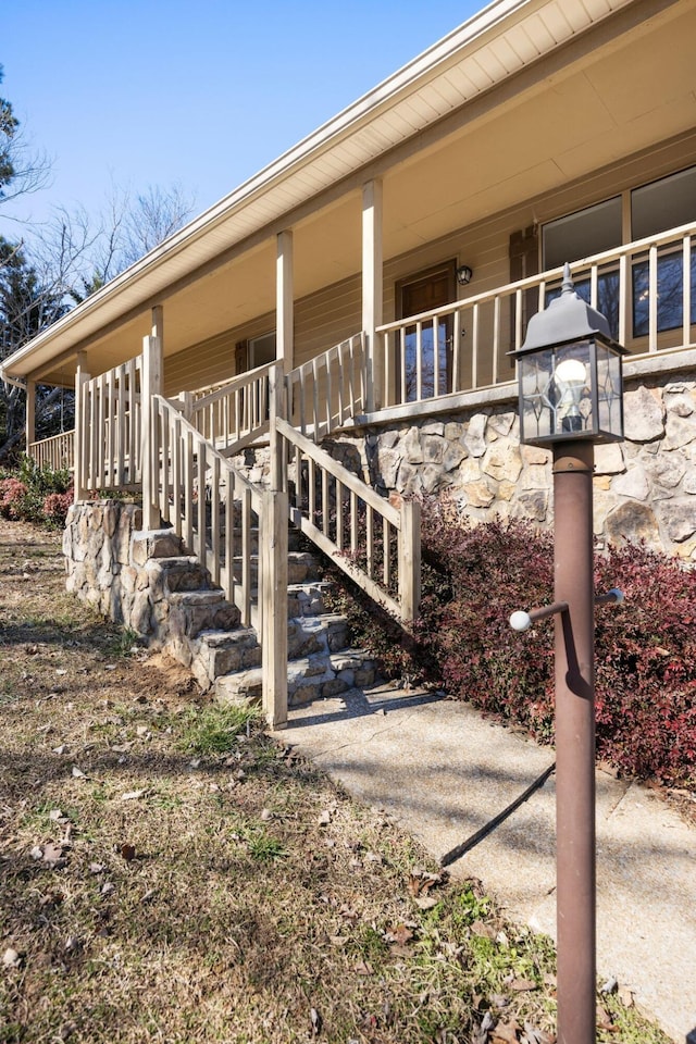 view of side of home with a porch