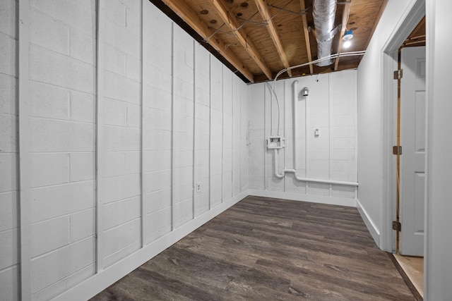 unfinished basement with dark wood-style floors