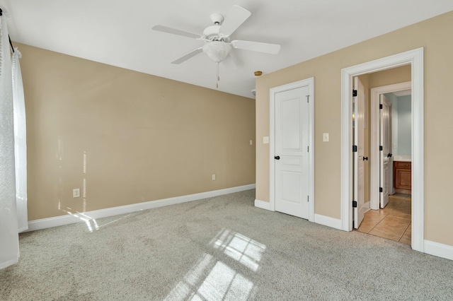 unfurnished bedroom with carpet flooring, ceiling fan, and baseboards