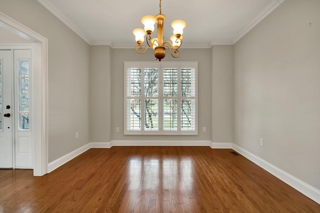 unfurnished dining area featuring a chandelier, crown molding, baseboards, and wood-type flooring