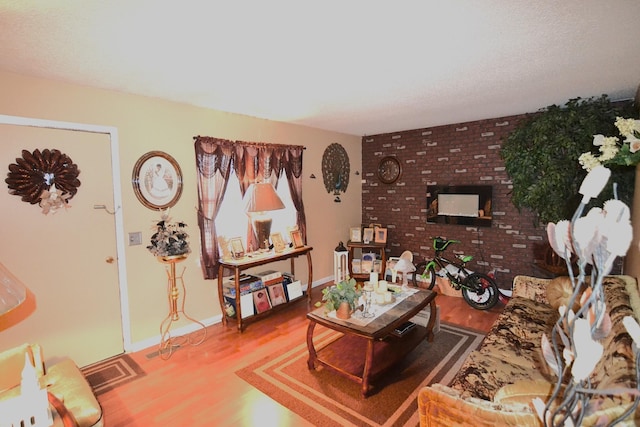 living area featuring wood finished floors and baseboards