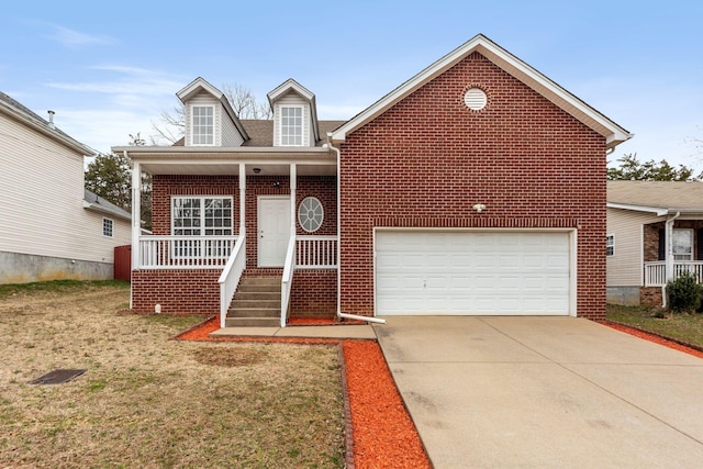 view of front of house with brick siding, an attached garage, a front lawn, covered porch, and driveway