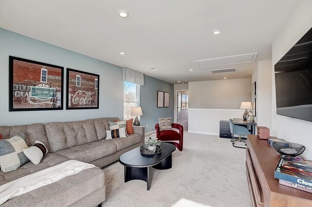 carpeted living room with recessed lighting, visible vents, and baseboards