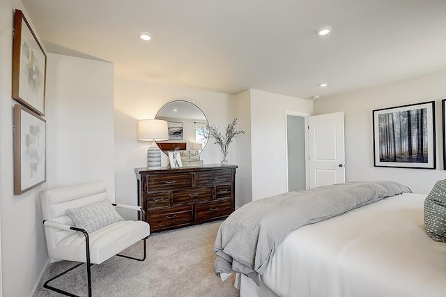 bedroom featuring light carpet and recessed lighting