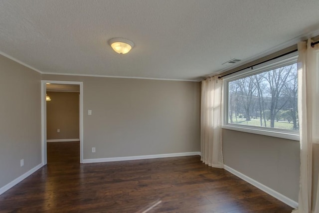 unfurnished room featuring dark wood finished floors, a textured ceiling, and baseboards