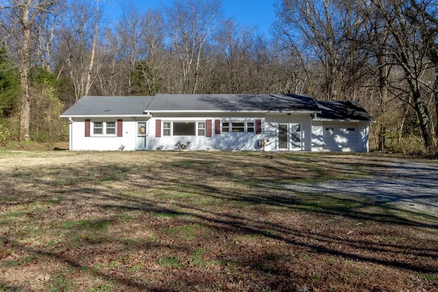 ranch-style house with a front lawn