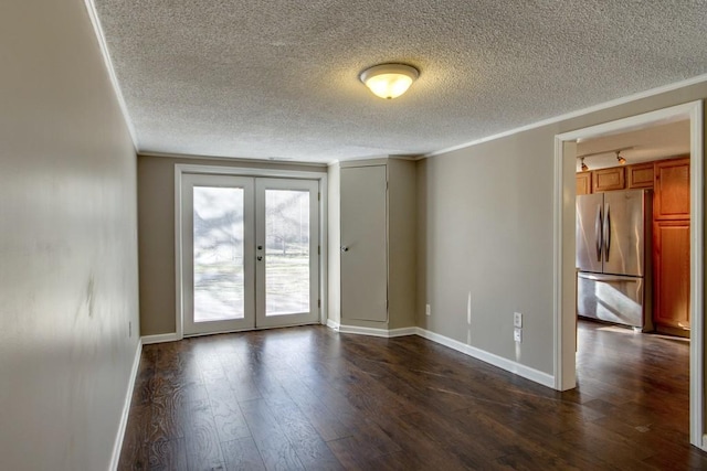 unfurnished room featuring ornamental molding, french doors, baseboards, and dark wood-style flooring