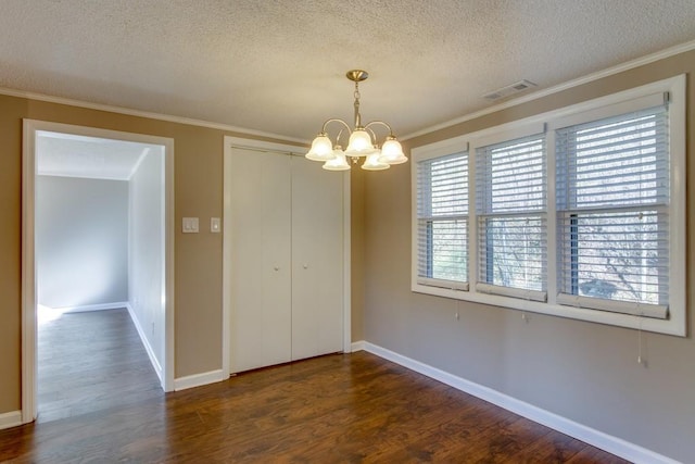 unfurnished dining area with visible vents, baseboards, a chandelier, dark wood-style floors, and a textured ceiling