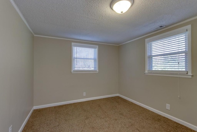 spare room with carpet flooring, plenty of natural light, and ornamental molding