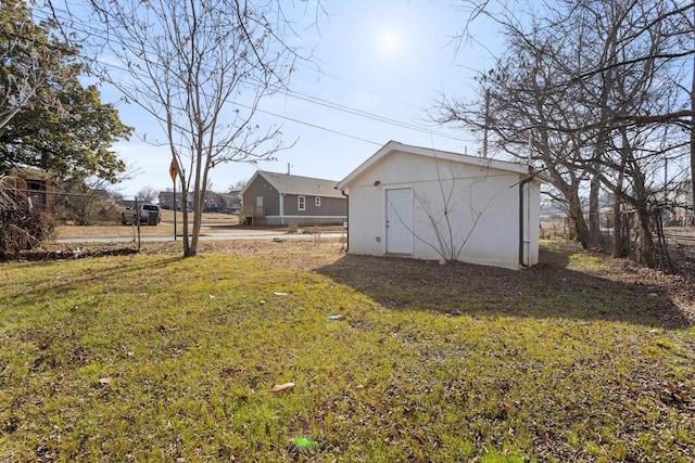 view of yard featuring a storage shed and an outbuilding