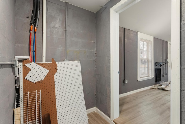 bathroom featuring wood finished floors and baseboards