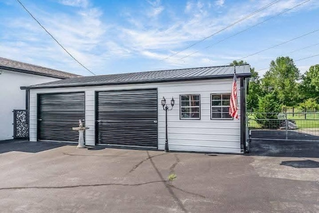 detached garage with fence