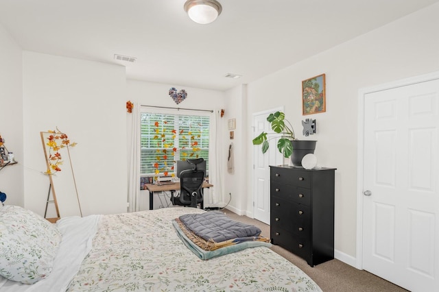 bedroom with visible vents, carpet floors, and baseboards