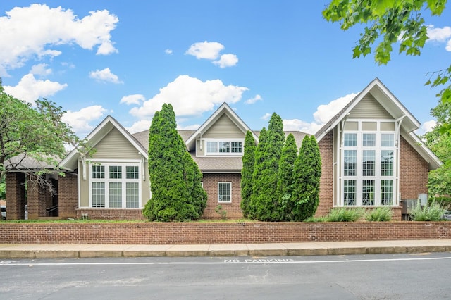 view of front facade featuring brick siding