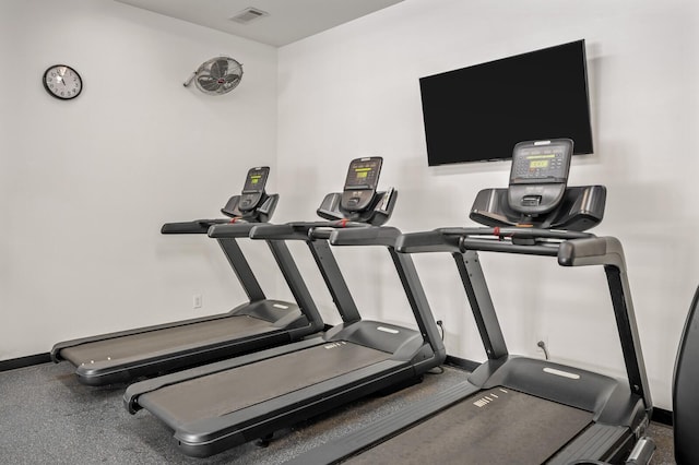 workout area with visible vents and baseboards