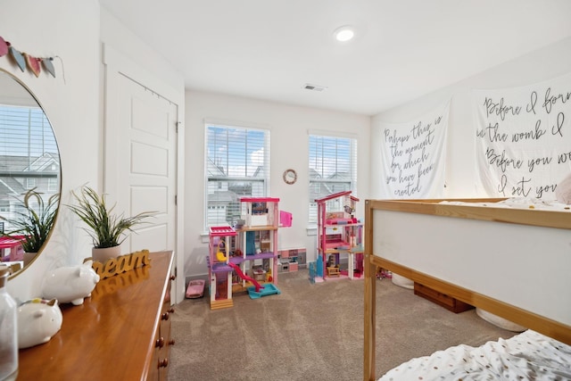 playroom with carpet flooring, visible vents, and baseboards