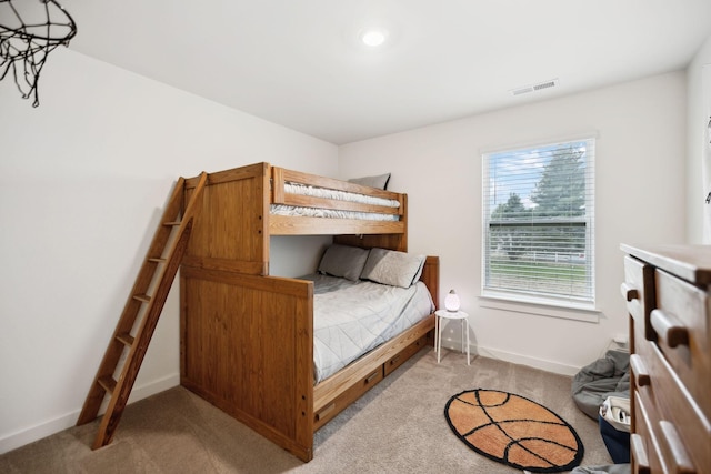 bedroom featuring light colored carpet, visible vents, and baseboards