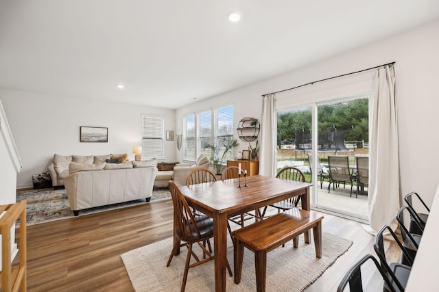 dining space with recessed lighting and light wood finished floors