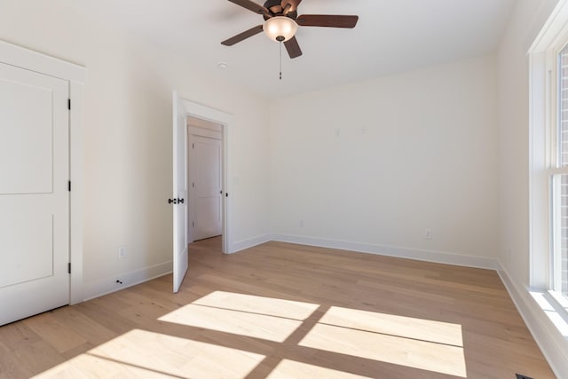 856 Tucker Rd, Dickson, TN 37055 - unfurnished bedroom with light wood-style flooring and a ceiling fan
