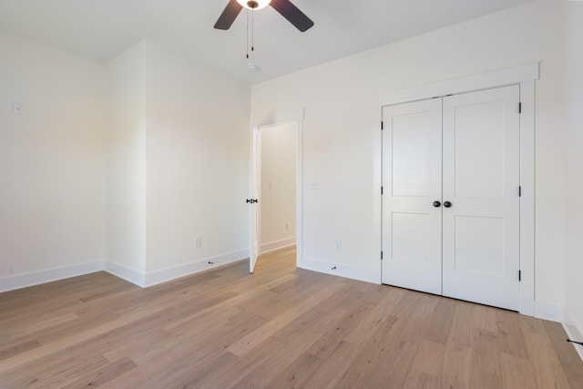 856 Tucker Rd, Dickson, TN 37055 - unfurnished bedroom with light wood finished floors, ceiling fan, and a closet