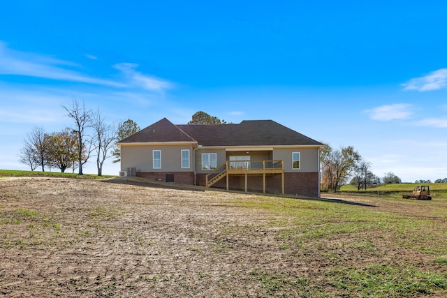856 Tucker Rd, Dickson, TN 37055 - back of house with a wooden deck, brick siding, stairs, and a yard