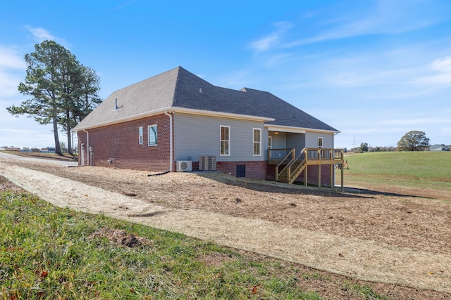 856 Tucker Rd, Dickson, TN 37055 - rear view of house featuring stairway, a deck, a shingled roof, and brick siding