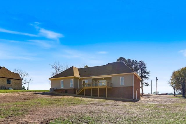 856 Tucker Rd, Dickson, TN 37055 - back of house featuring a wooden deck, stairway, and brick siding