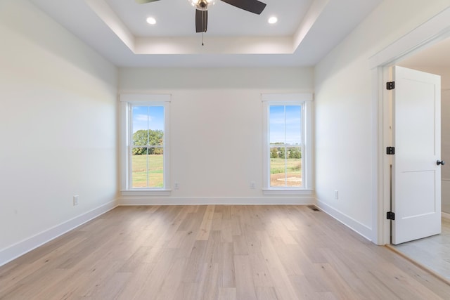 856 Tucker Rd, Dickson, TN 37055 - unfurnished room featuring light wood-style floors, a raised ceiling, and a ceiling fan