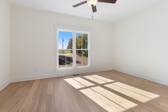 856 Tucker Rd, Dickson, TN 37055 - unfurnished room featuring light wood-style flooring and ceiling fan