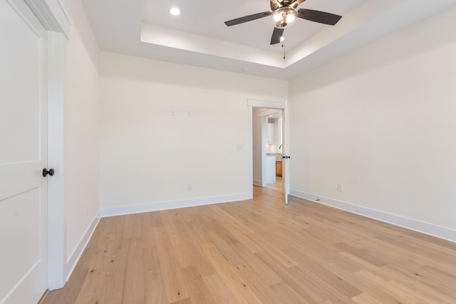 856 Tucker Rd, Dickson, TN 37055 - spare room with a tray ceiling, a ceiling fan, light wood-style flooring, and recessed lighting
