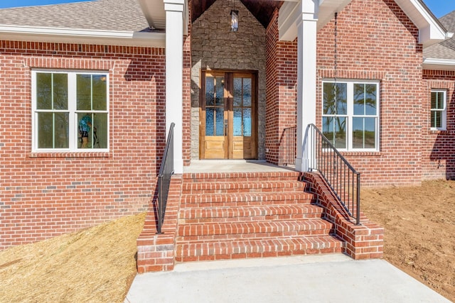 856 Tucker Rd, Dickson, TN 37055 - property entrance featuring french doors, a shingled roof, and brick siding