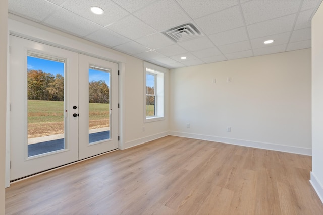 856 Tucker Rd, Dickson, TN 37055 - empty room featuring french doors, light wood finished floors, a drop ceiling, and recessed lighting
