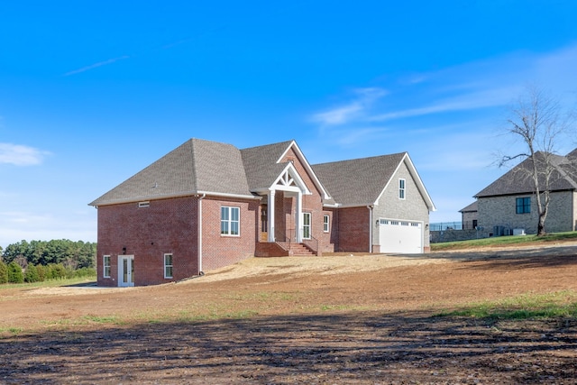 856 Tucker Rd, Dickson, TN 37055 - craftsman house featuring brick siding, driveway, and a shingled roof