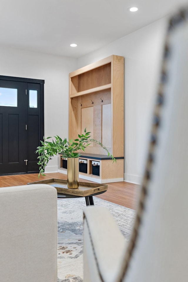 interior space with recessed lighting, baseboards, and wood finished floors