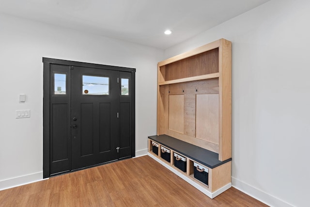 mudroom featuring recessed lighting, baseboards, and wood finished floors